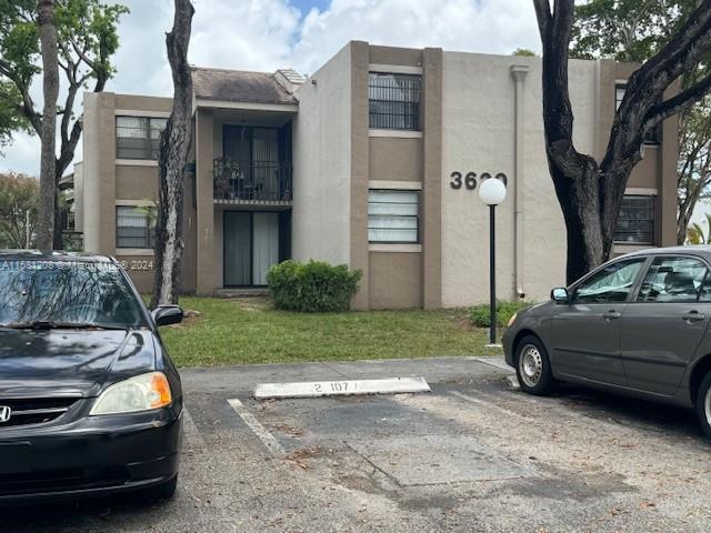 a view of a car in front of a house