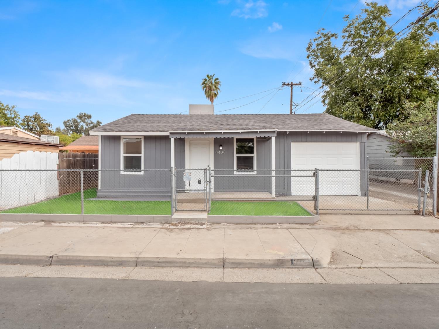 a view of front of house with a yard