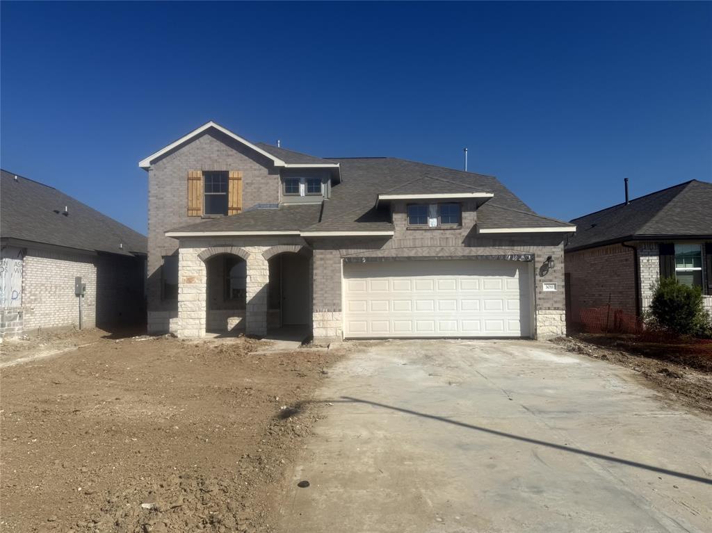 a front view of a house with yard