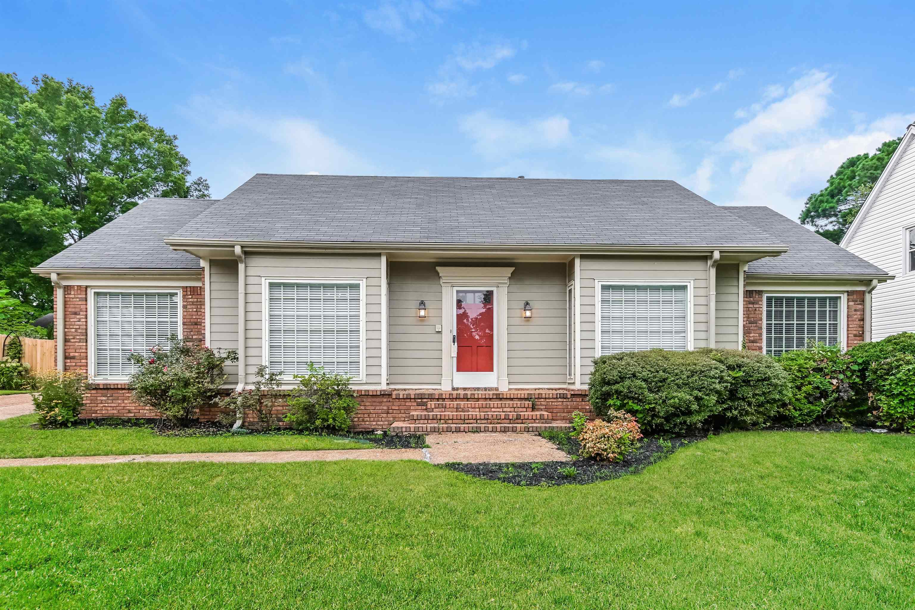 front view of a house with a yard