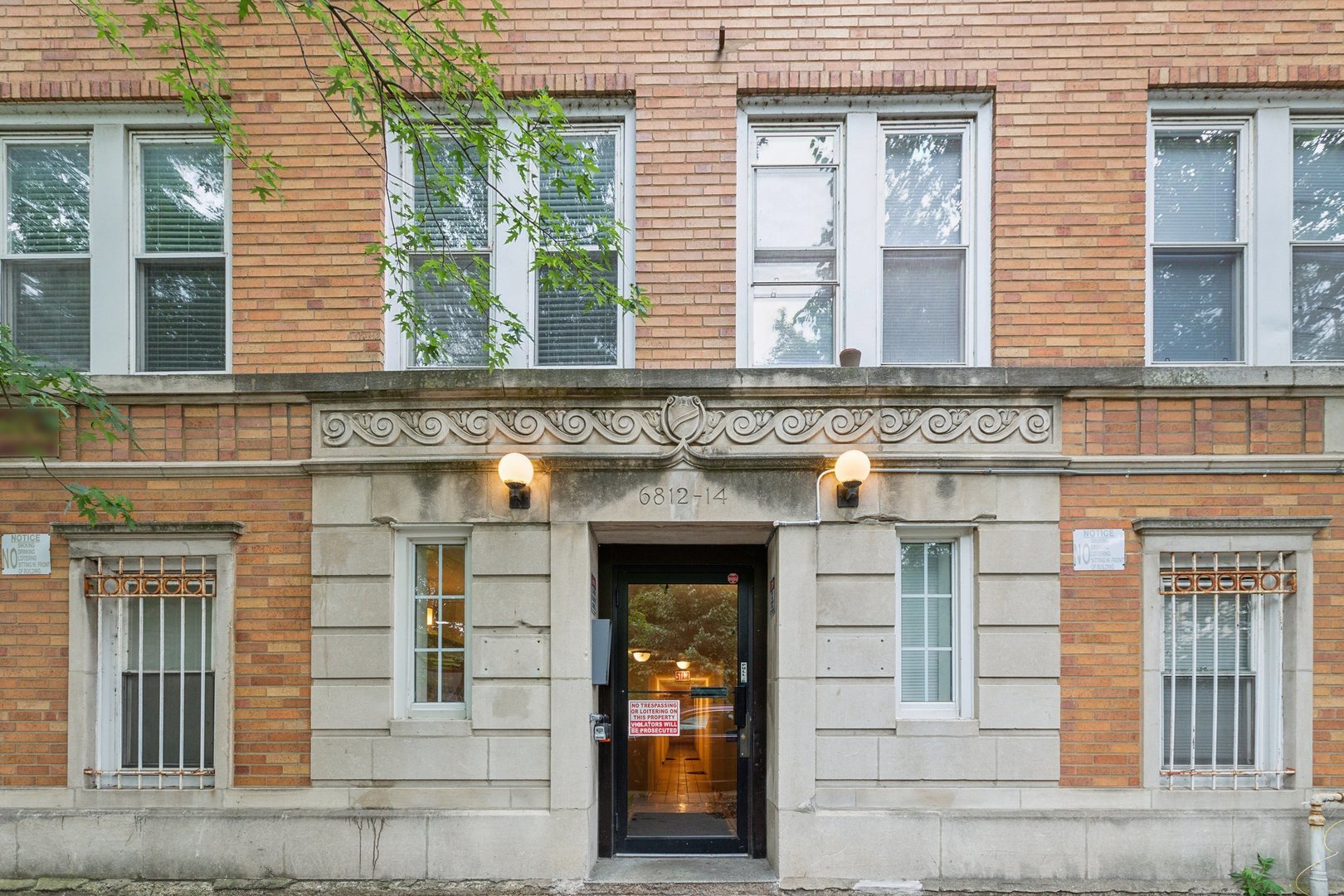 front view of a brick house with a door