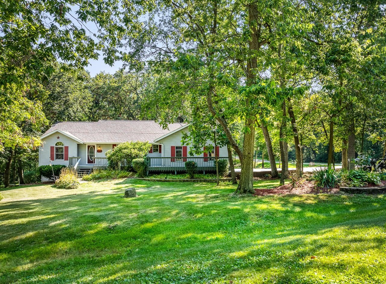 a view of a house with a yard porch and sitting area