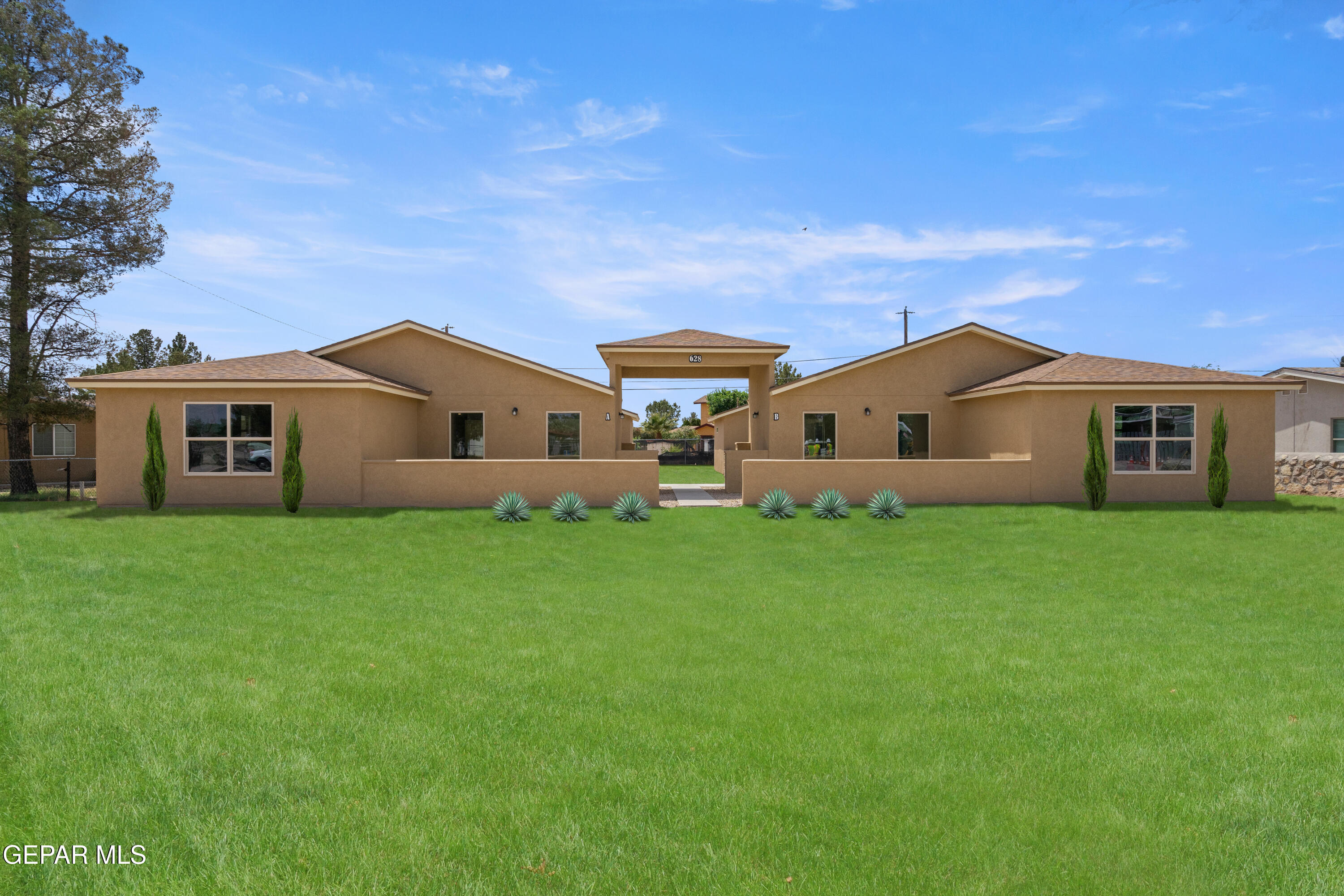 a view of a house with backyard and garden