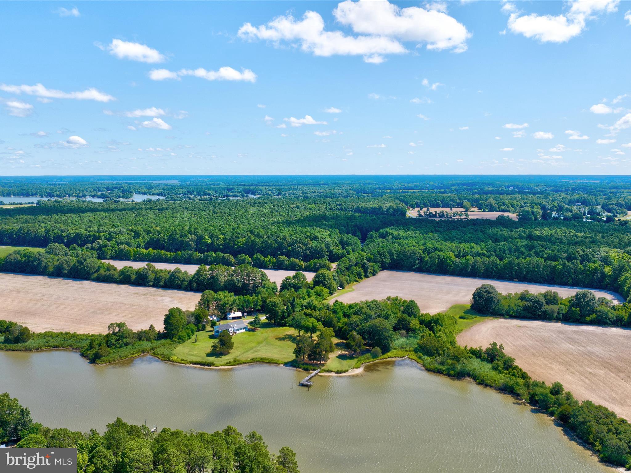 a view of a lake with a yard