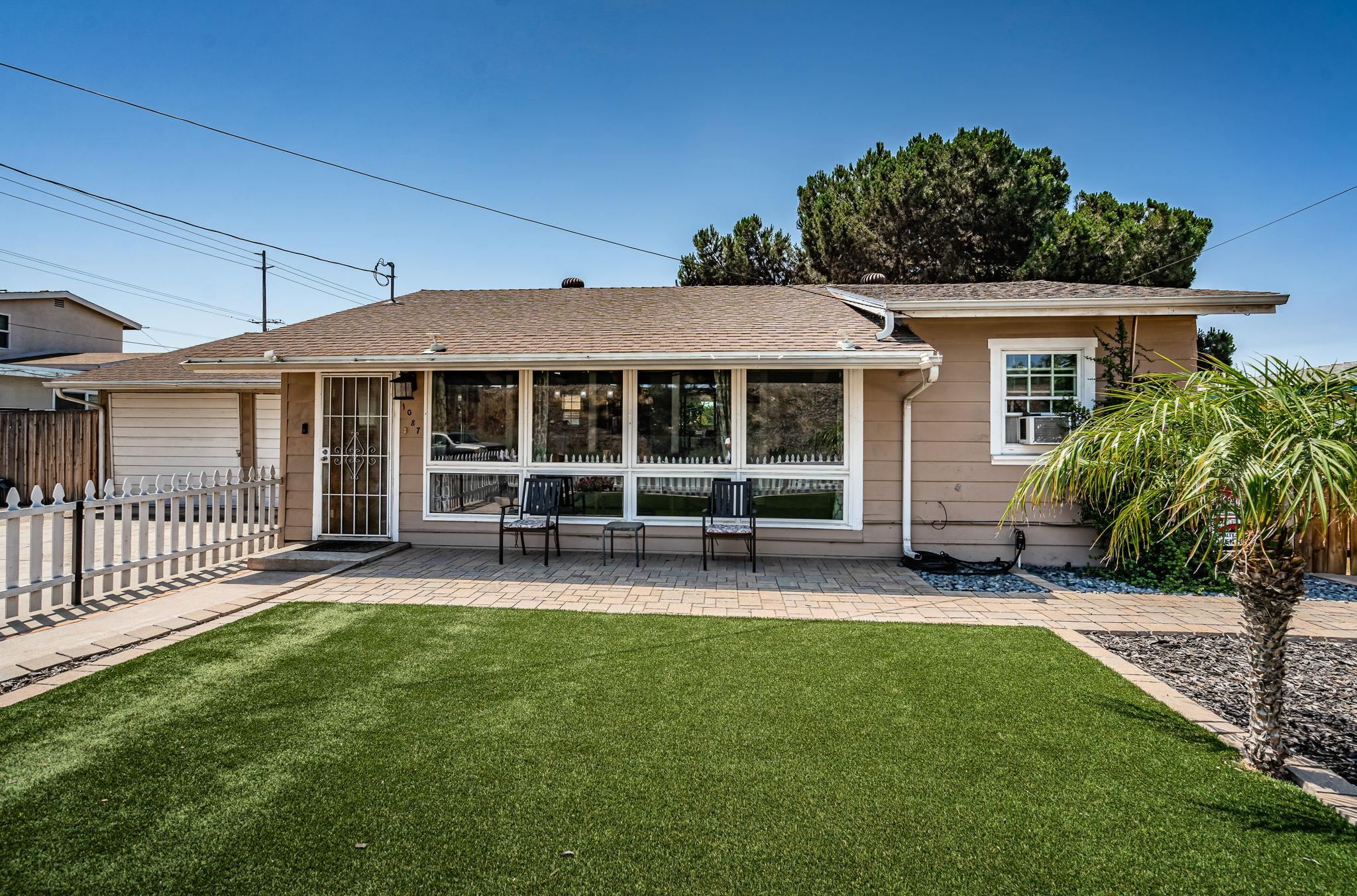 front view of a house with a yard