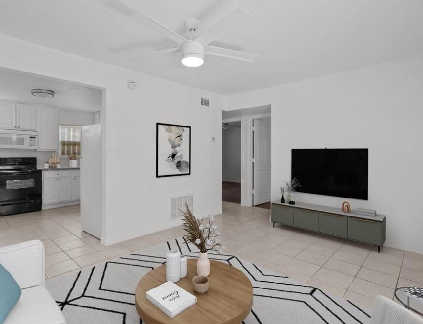 a living room with furniture and a flat screen tv