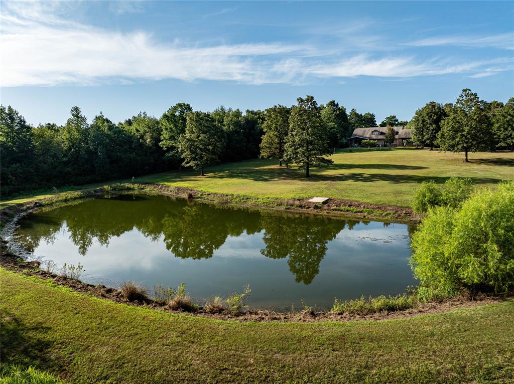 a view of a lake with a yard