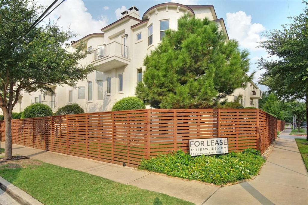 a view of a brick house with a yard