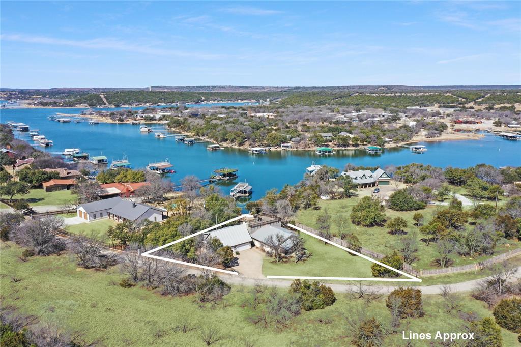 an aerial view of a house with a lake view