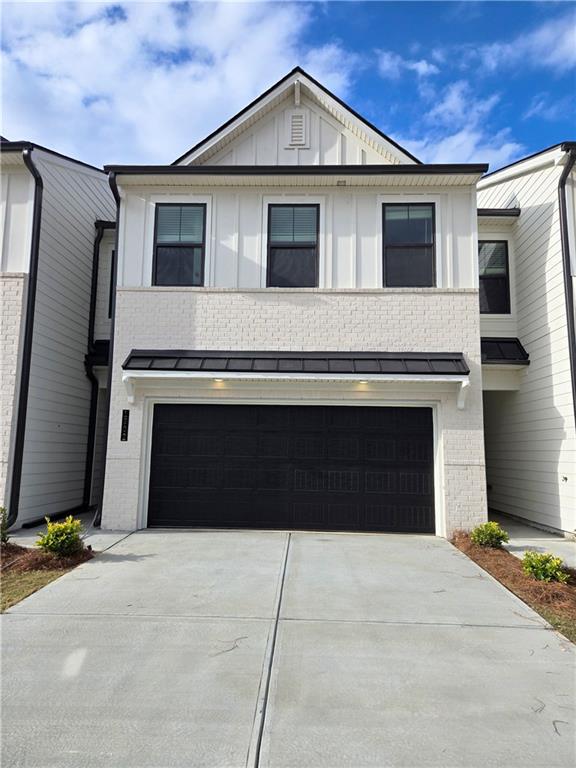 a front view of a house with a garage