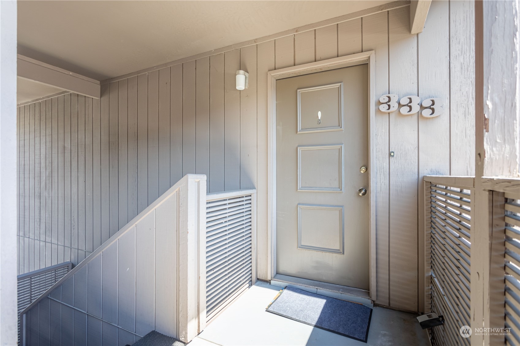 a view of a hallway with entryway door