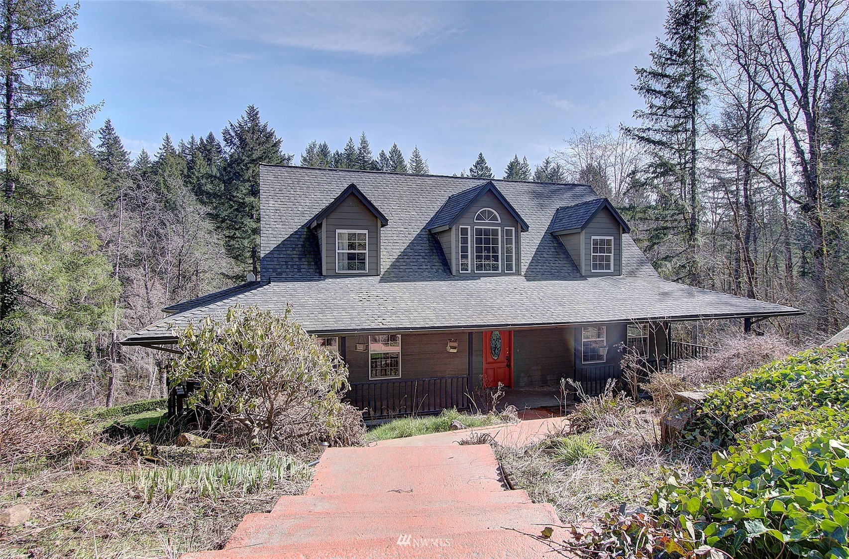 a front view of a house with garden