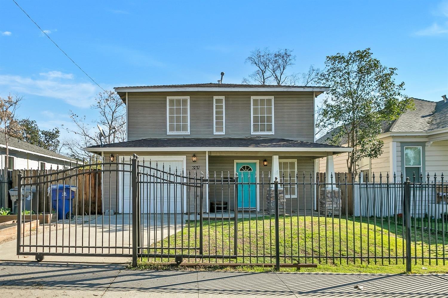 a view of a house with a iron gate