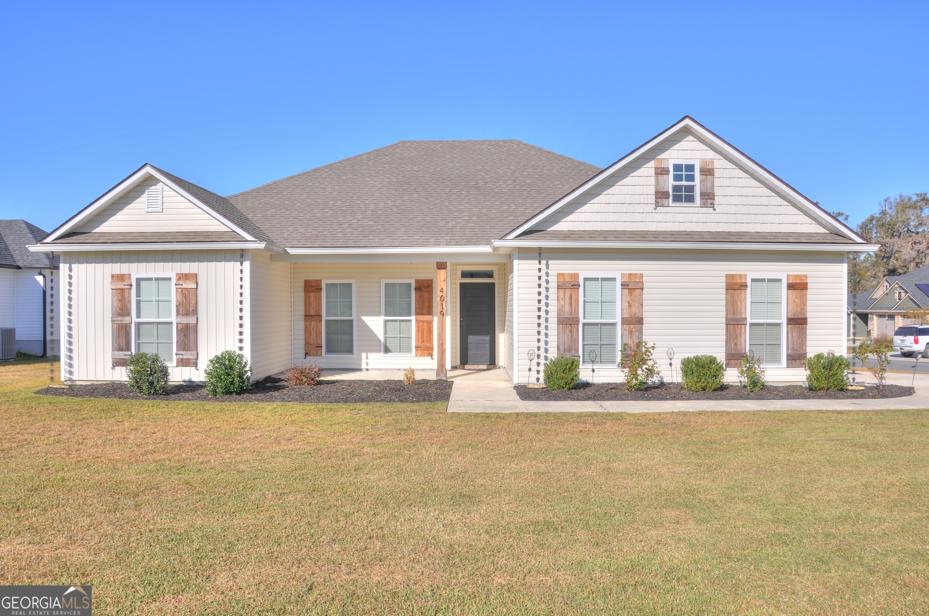 a front view of a house with a yard