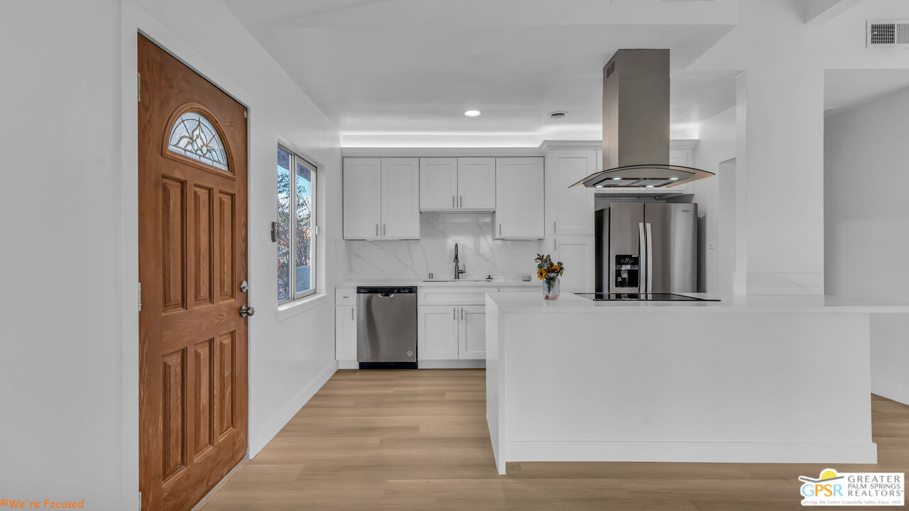 a view of a kitchen with an entryway