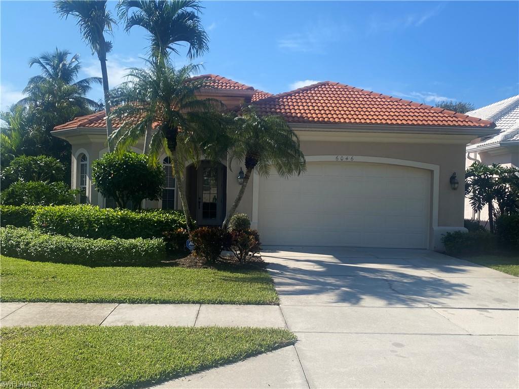 a front view of a house with a garage