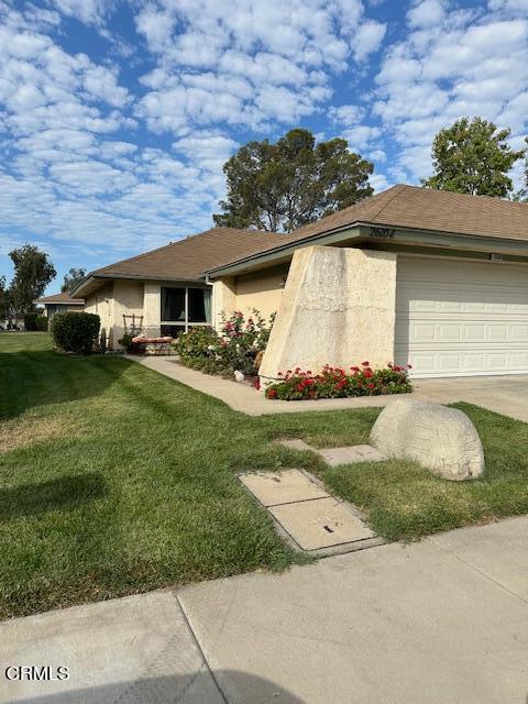 front view of a house with a yard