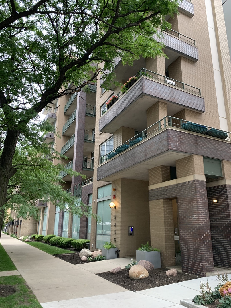 a view of a building with a tree