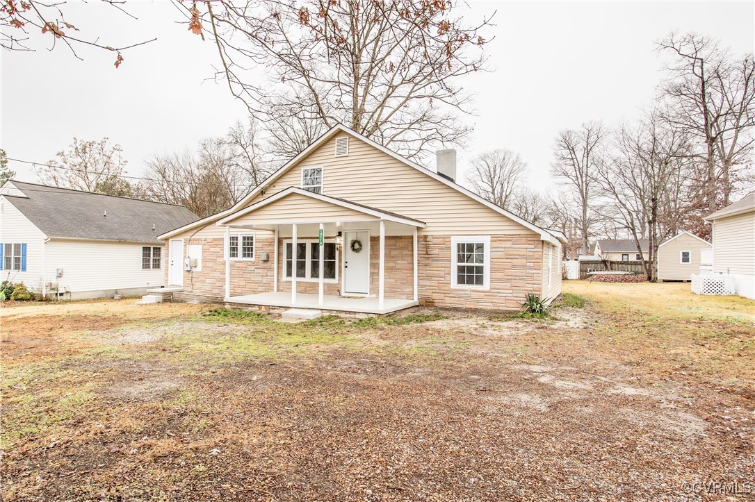 View of front of home featuring covered porch and