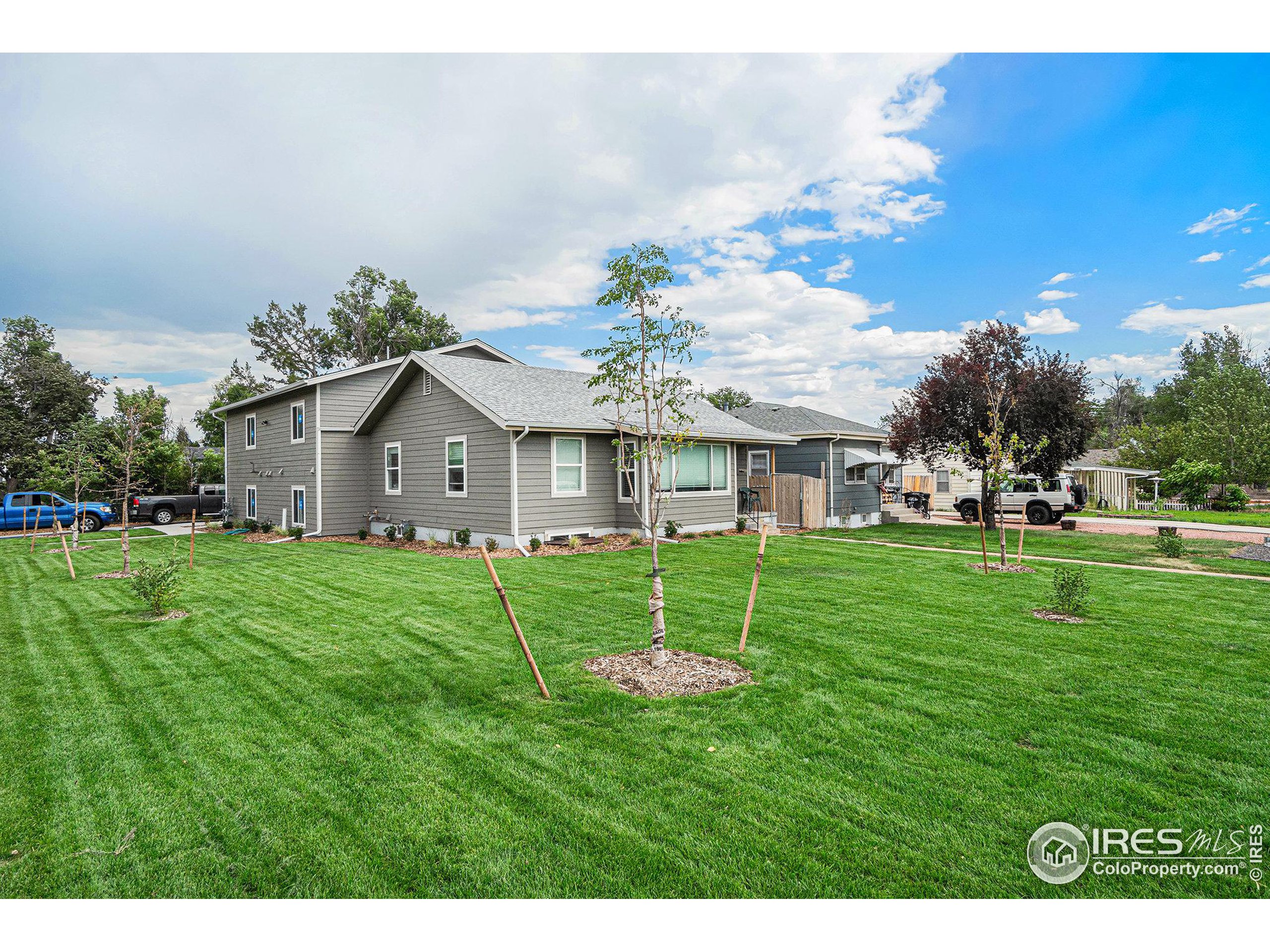 a view of an house with backyard space and garden