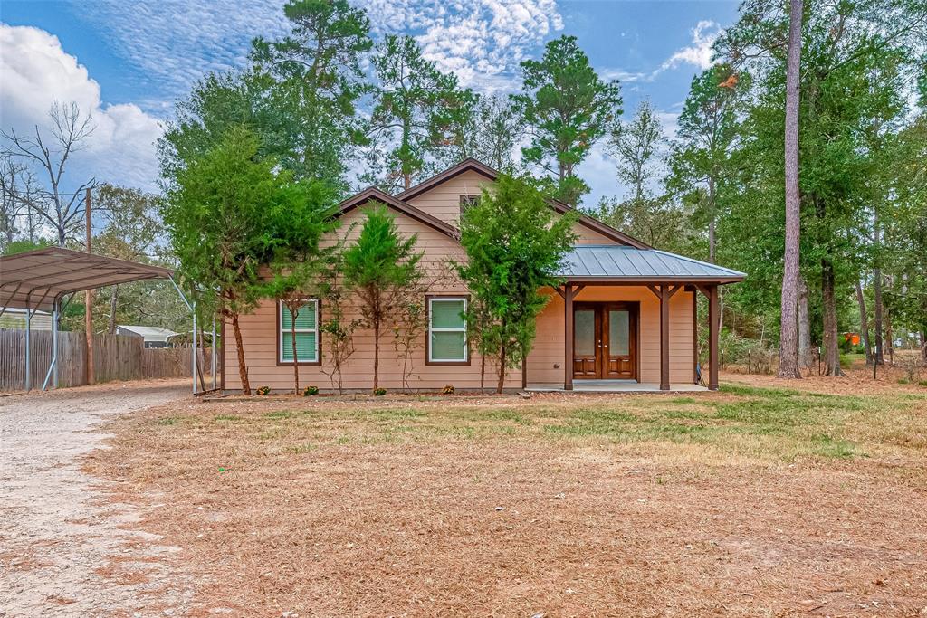 front view of a house with a big yard