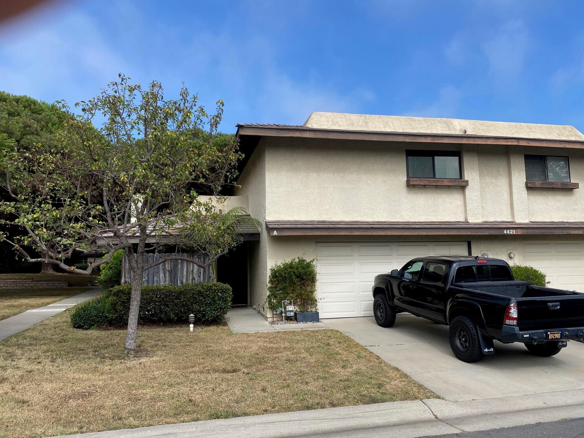 a car parked in front of a house