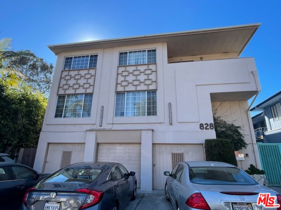 a front view of a house with parking