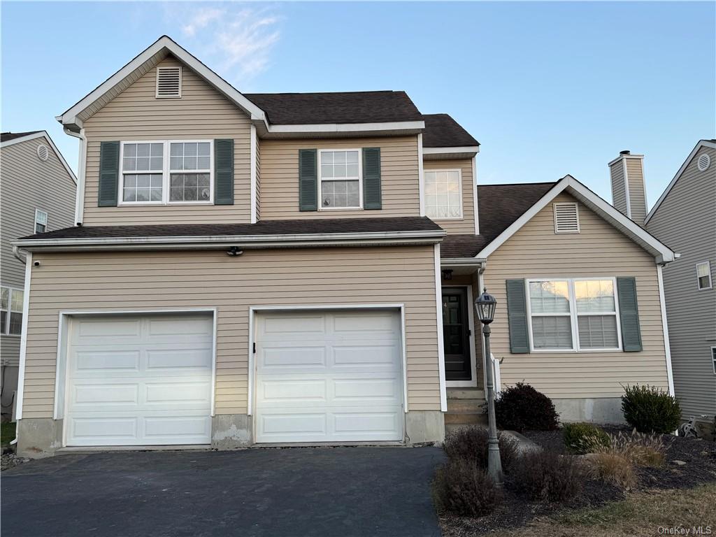 Front of property with two car garage