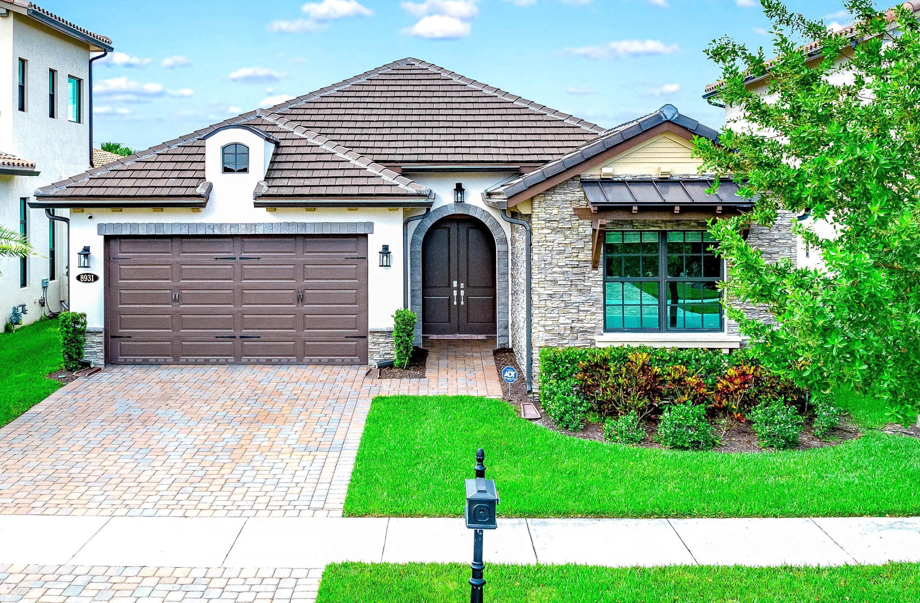 a front view of a house with garden