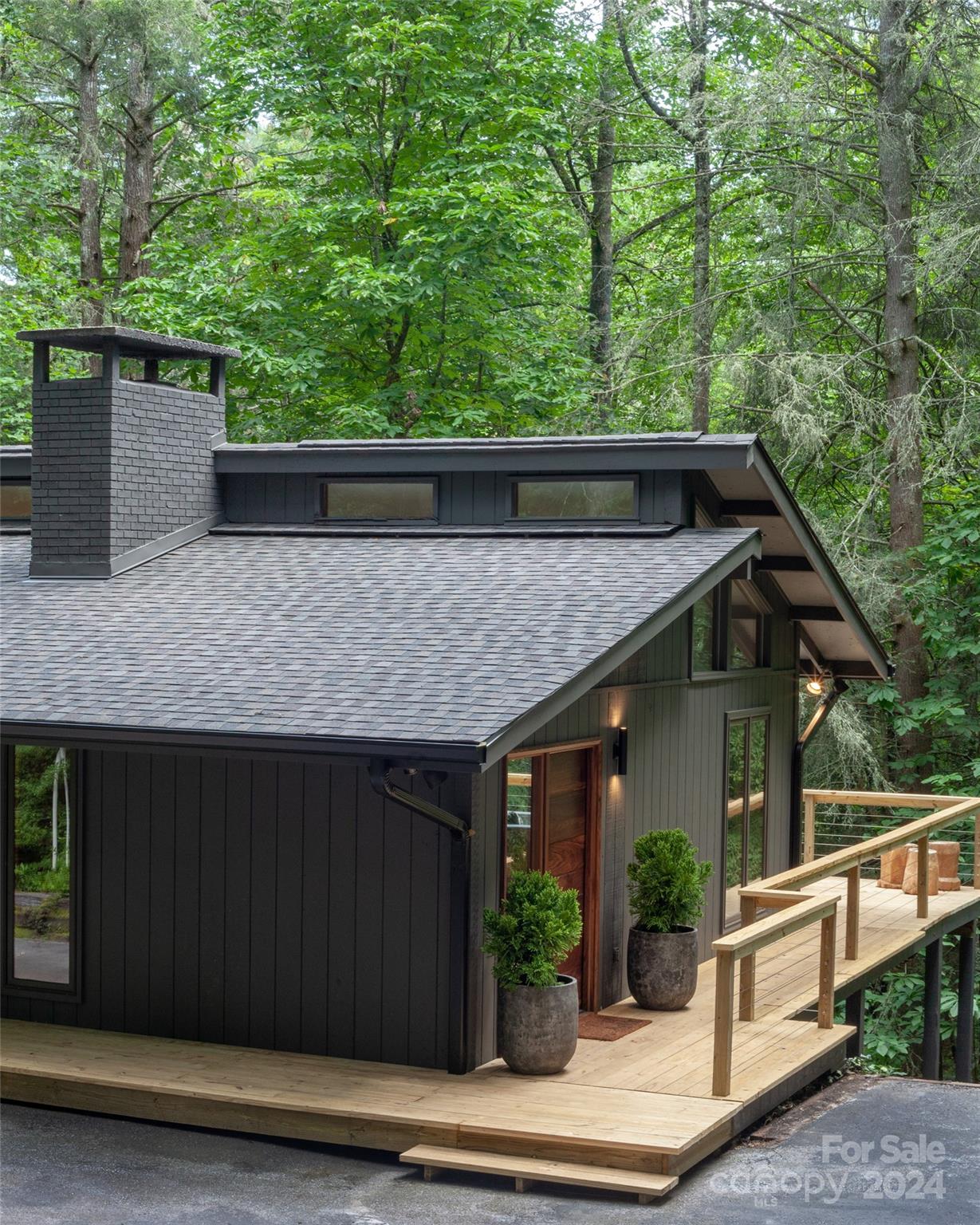 a view of house with green space and seating space