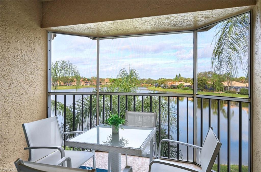 a view of a balcony with chair and wooden floor