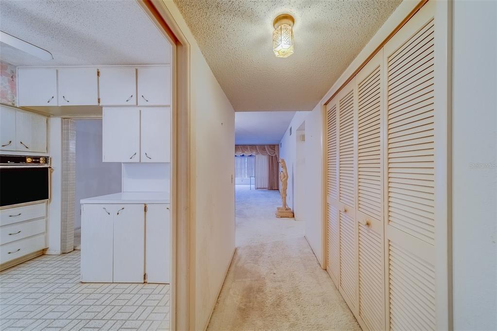 a view of a kitchen from the hallway