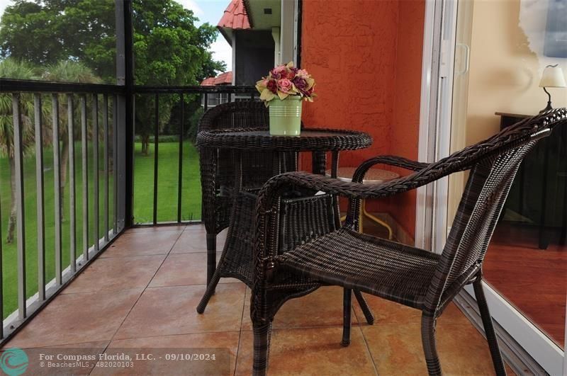 a view of balcony with furniture