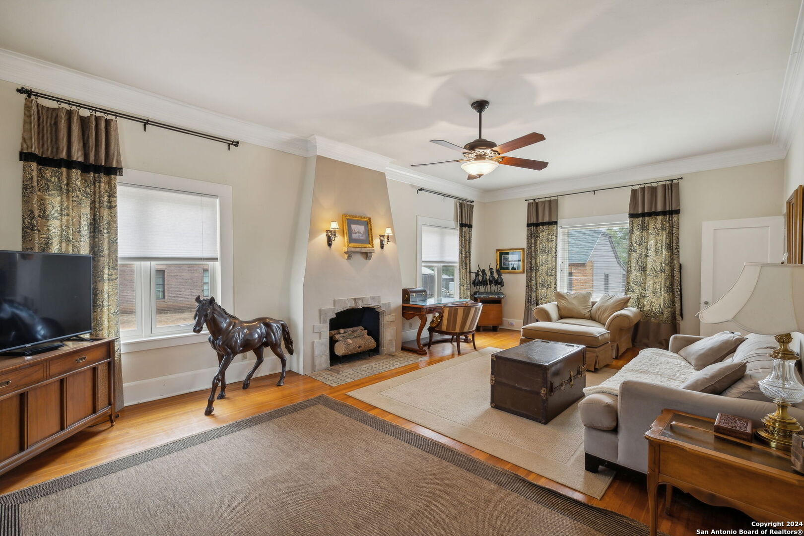 a living room with furniture and a flat screen tv