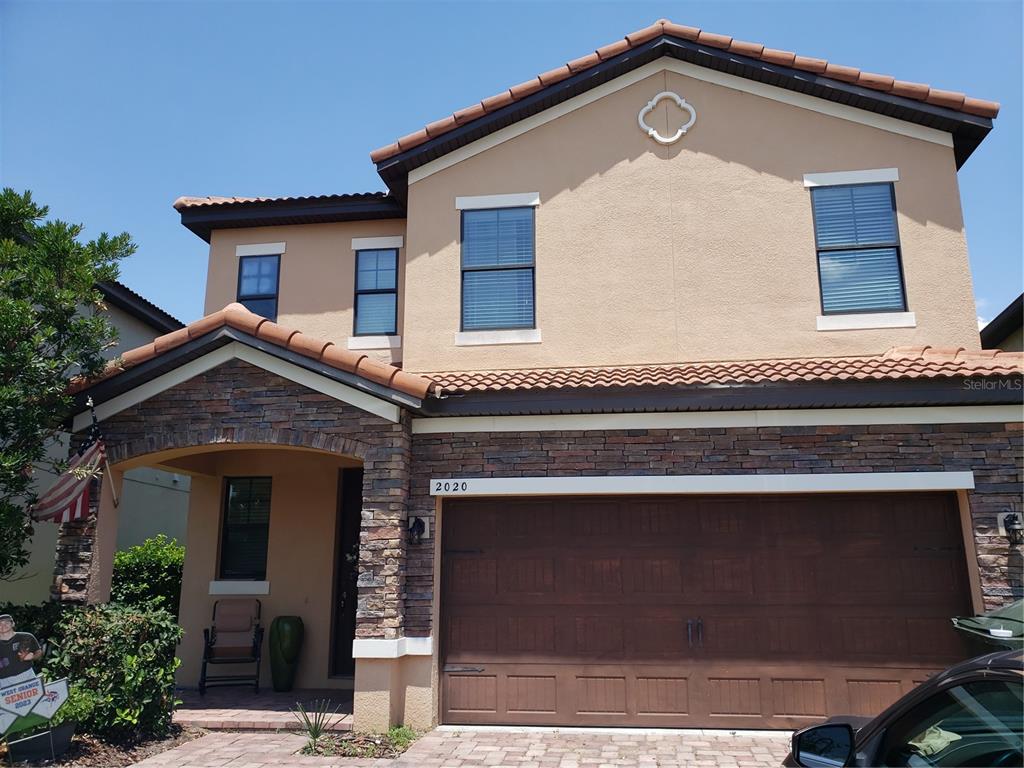 a front view of a house with a garage