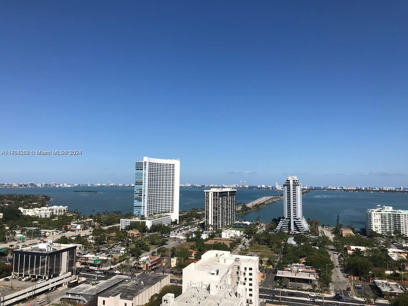 a view of a city with tall buildings