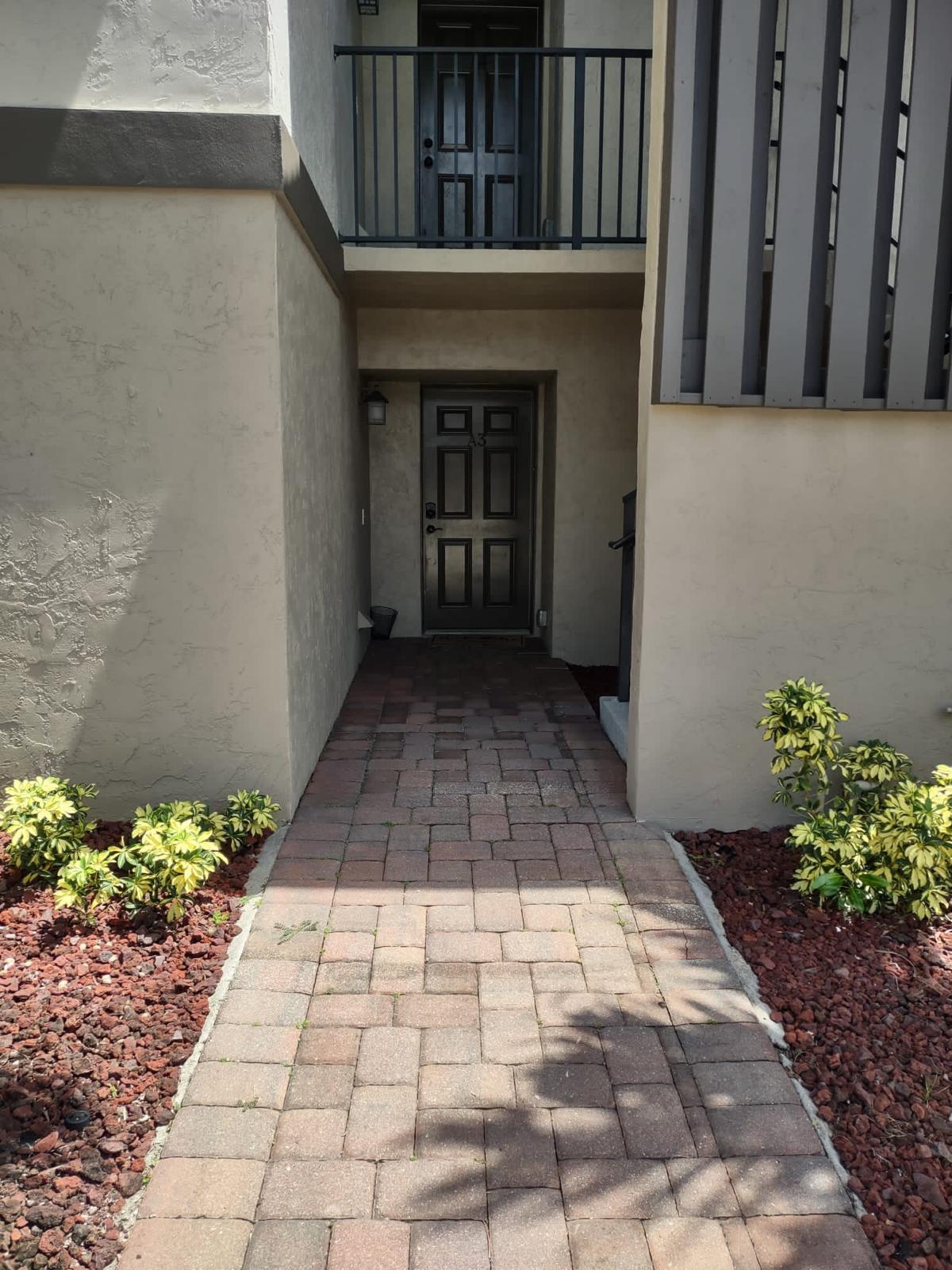 a view of entryway with a flower garden