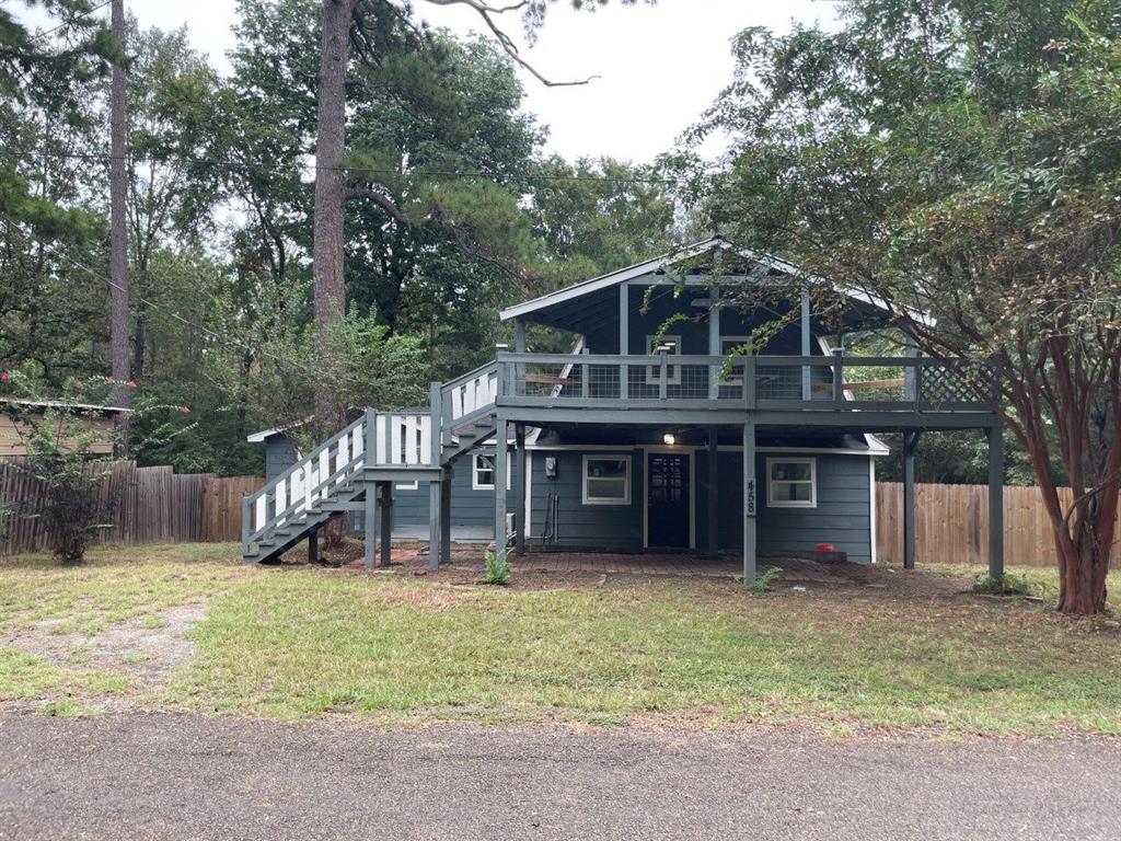 a view of a house with a yard balcony