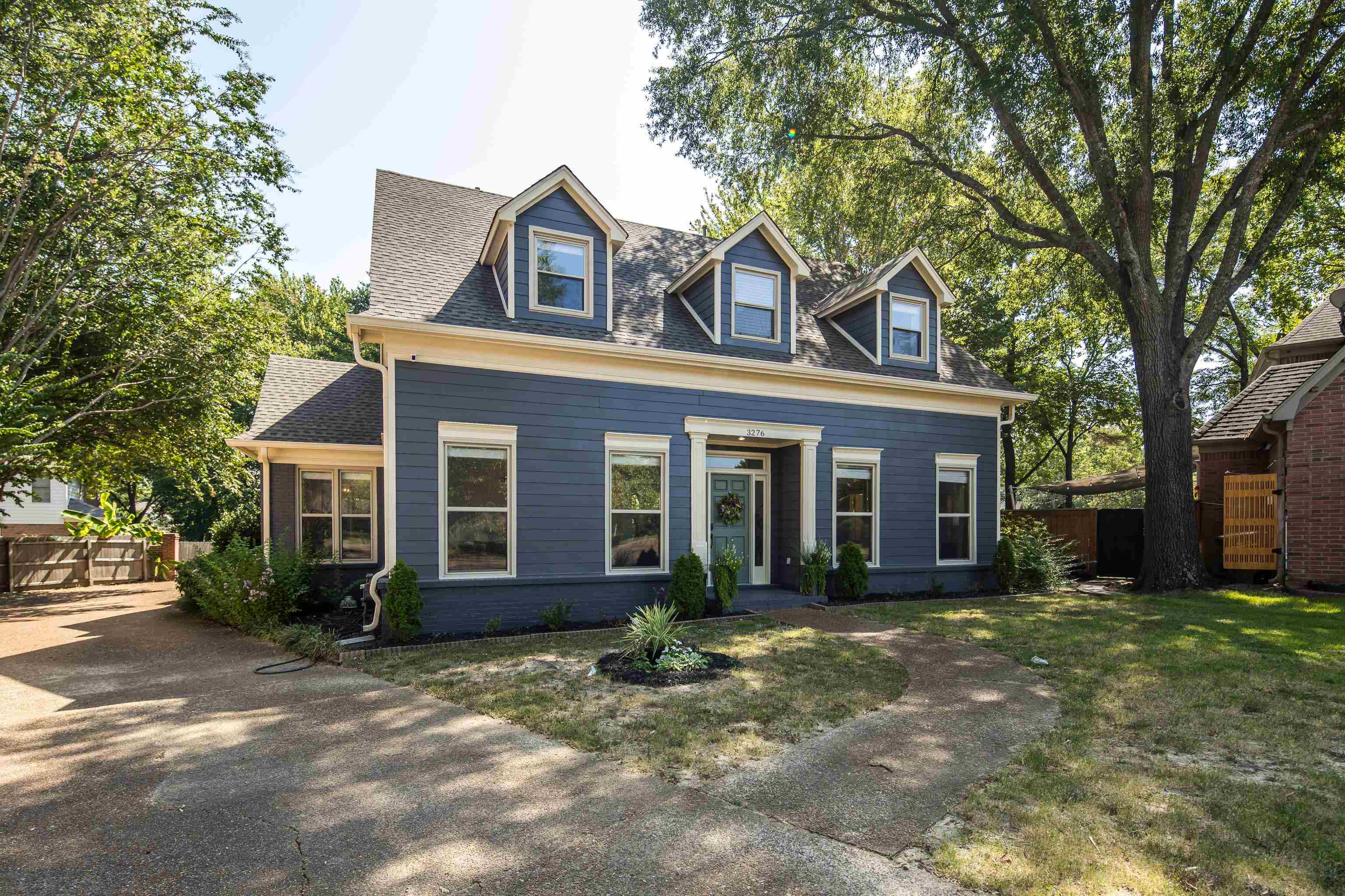 front view of a house with a yard