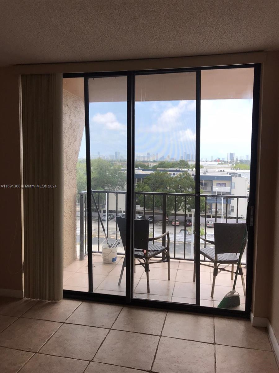 a view of a floor to ceiling window in an empty room