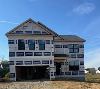 a front view of a house with glass windows