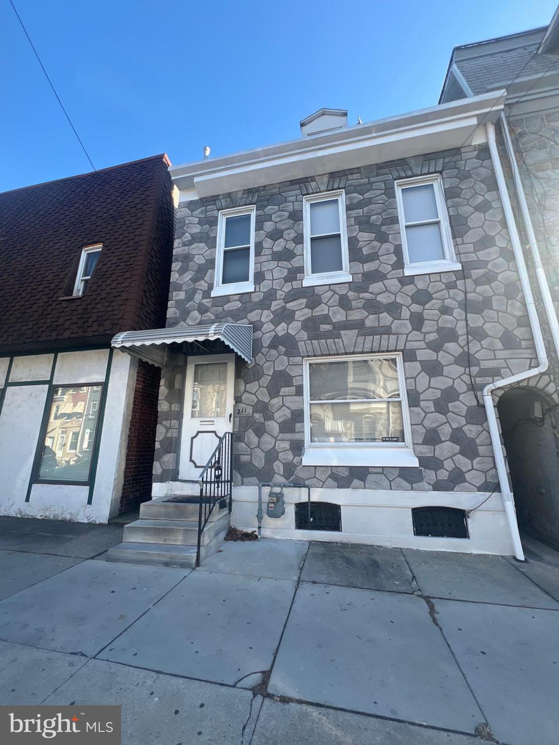 a front view of a house with stairway