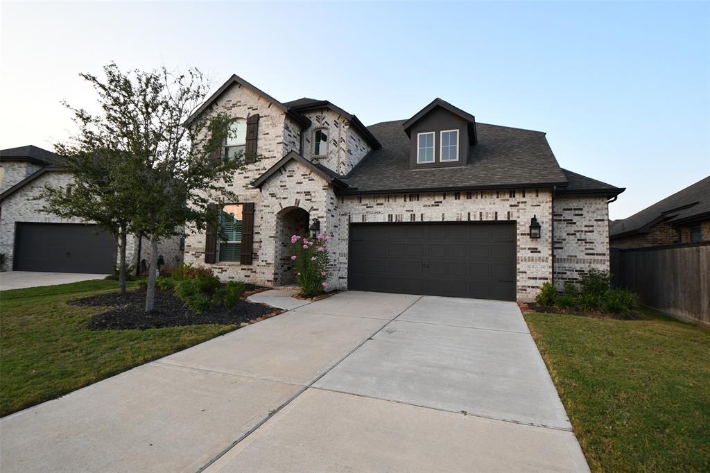 a front view of a house with yard