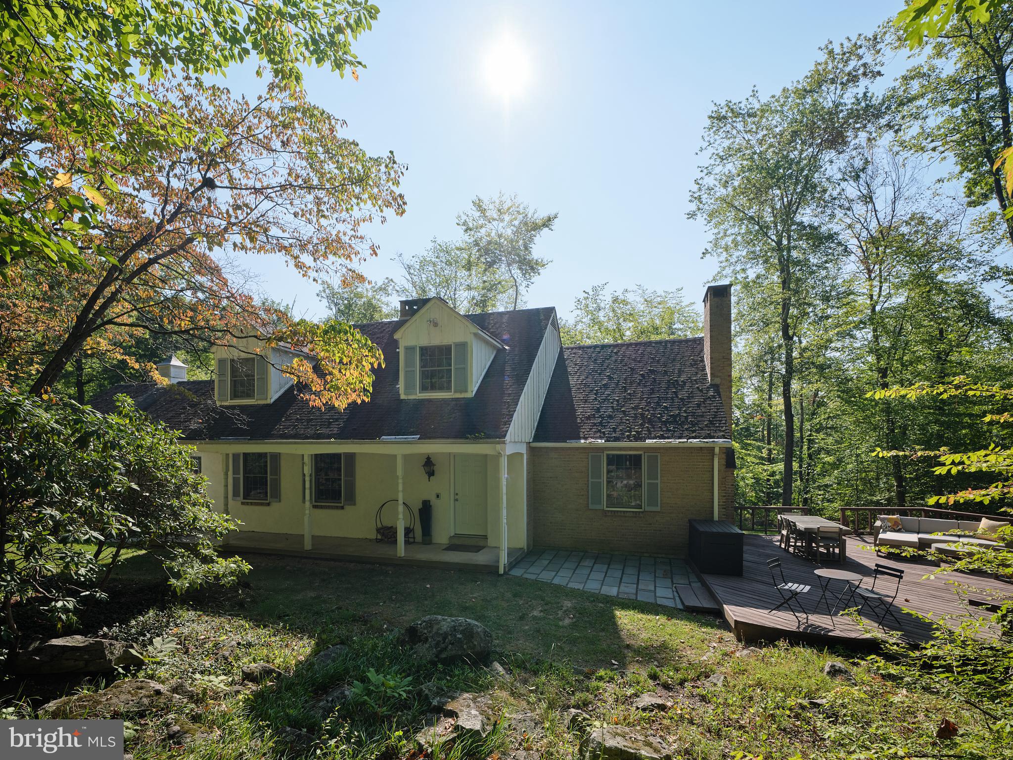 a view of house with a yard