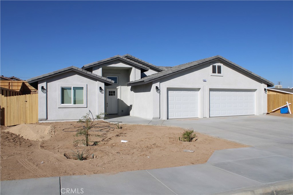 a front view of a house with a garage