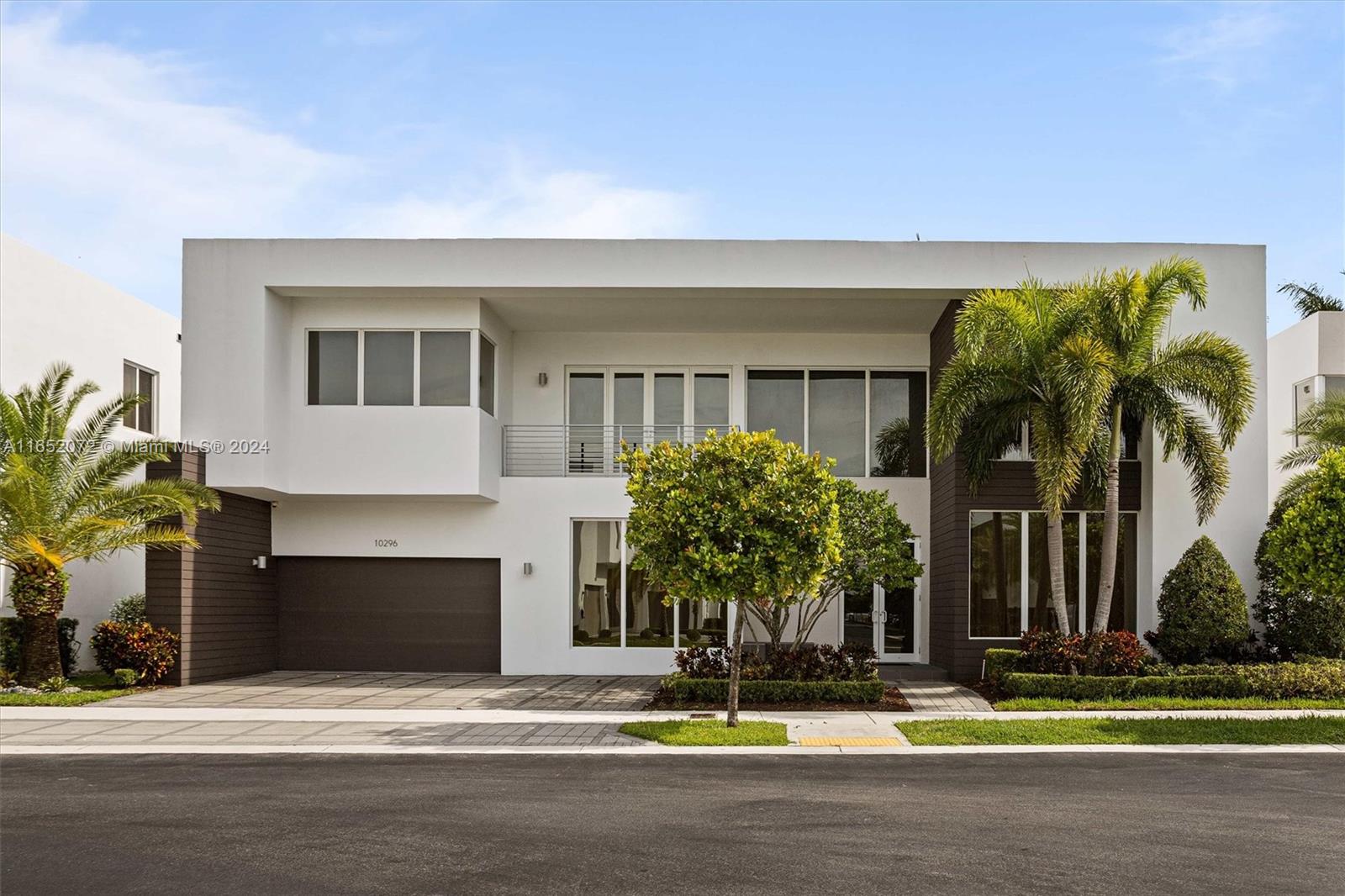 a house with palm tree in front of it