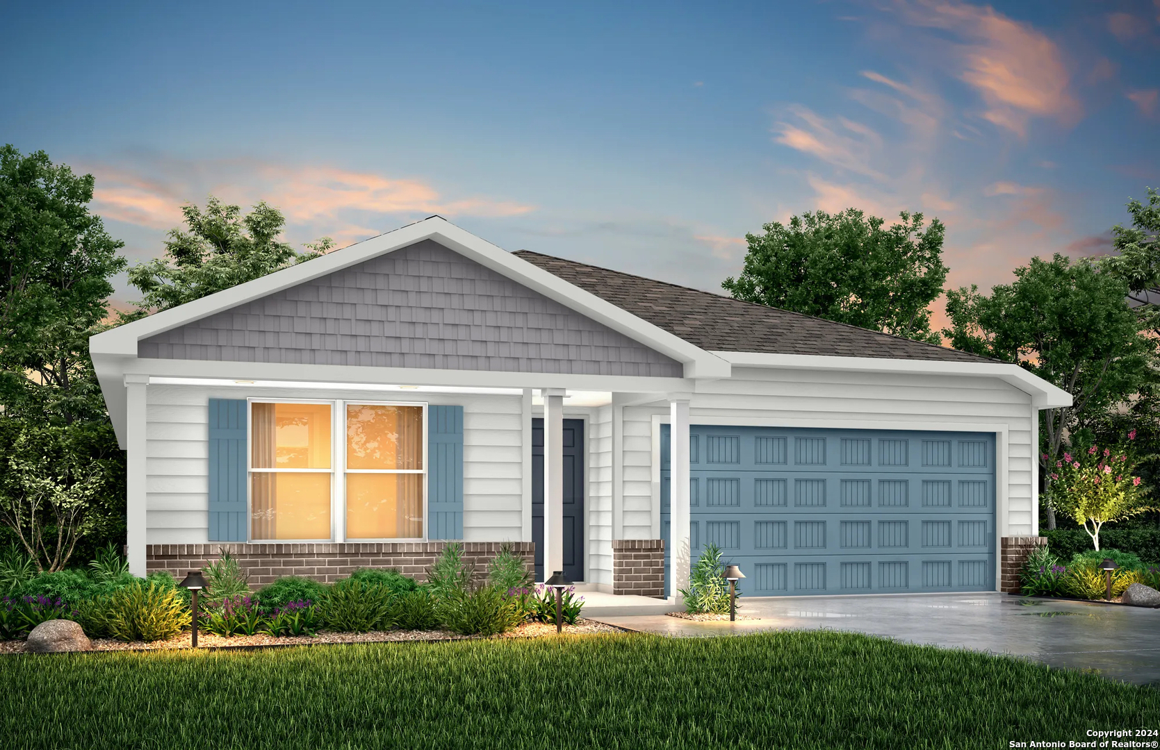 a front view of a house with a yard and garage