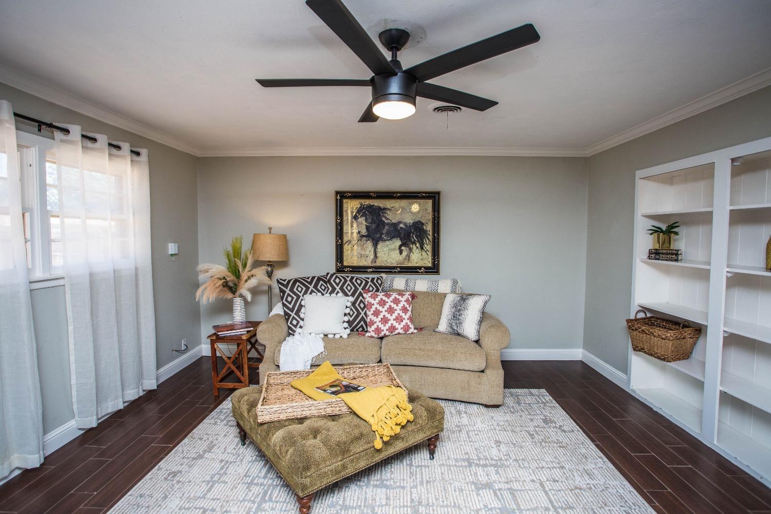 a living room with furniture and a rug