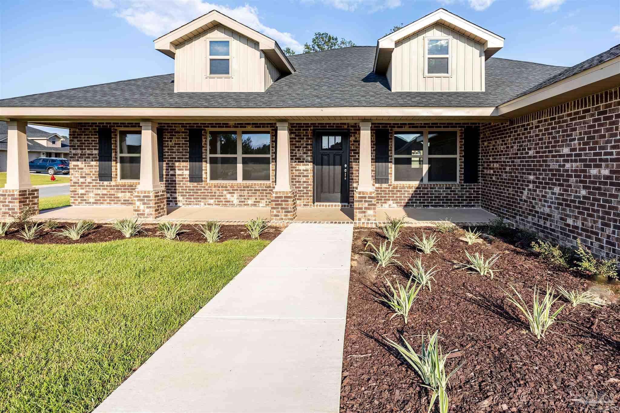 front view of a house with a yard