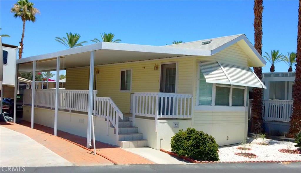 a front view of a house with a porch